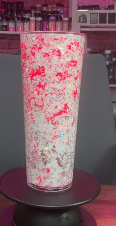 #60. 24 oz acrylic V-shape white and silver with pink lava
